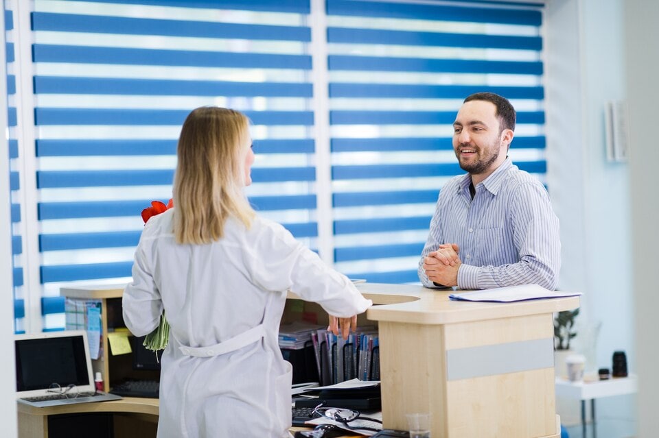 httpsimg.freepik.compremium photonurse patient conversing reception desk hospital 160360 2027.jpgw1060