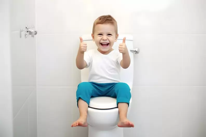 freepicdownloader.com excited kid sitting toilet normal bowel habit concept medium